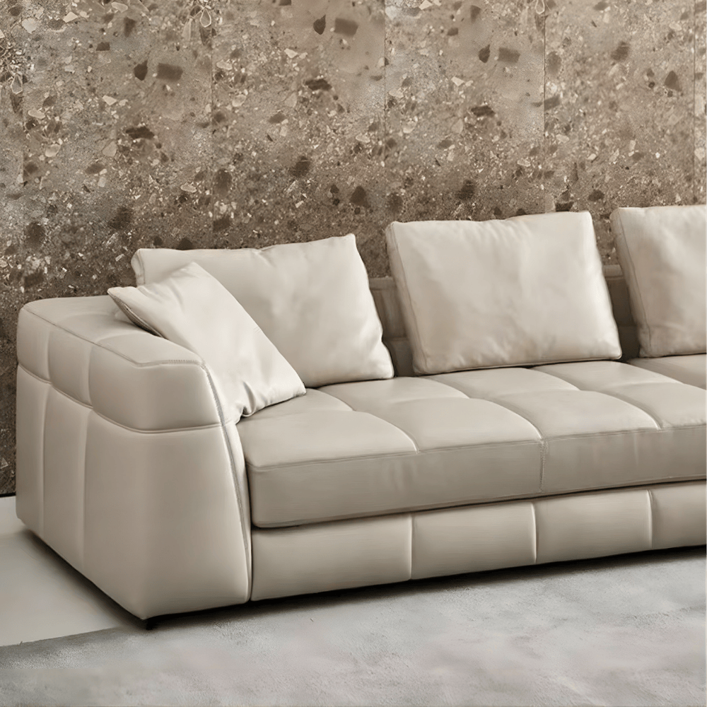 Detailed view of seat cushions and quilted leather texture on modular sofa. Detailed view of seat cushions and quilted leather texture on modular sofa.
